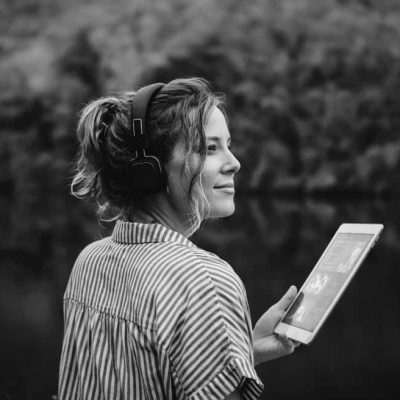 woman-alone-nature-listening-music-with-headphones-dig-min